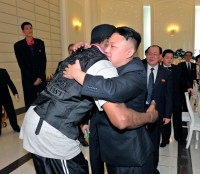 North Korean leader Kim Jong-Un and former NBA basketball player Dennis Rodman hug in Pyongyang
