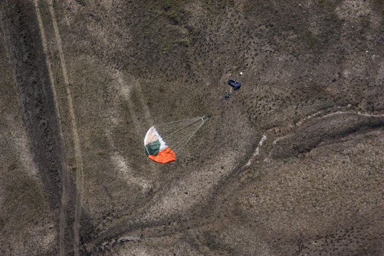 A parachute lays on a field after a B-1B bomber crashed in a remote area near Broadus, Mont., Aug. 19, 2013.
