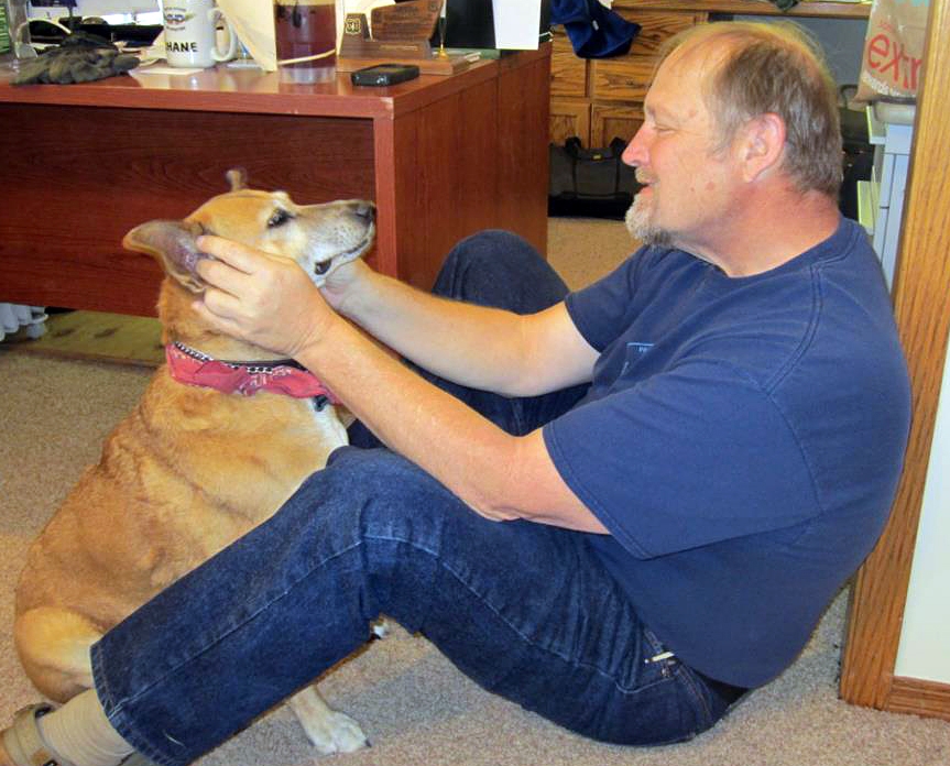 Shane Krogen plays with Susan's dog Weezee in Fresno, Calif., in Feb. 2013.