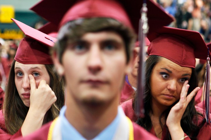 Students show emotions at the Joplin High School commencement ceremony in Missouri