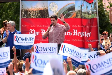 Republican Vice Presidential candidate, Rep. Paul Ryan, accompanied by Iowa Gov. Terry Branstad, left, speaks at the Iowa State Fair in Des Moines, Monday, Aug. 13, 2012.