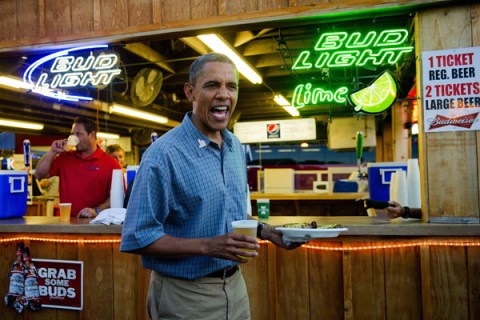 President Barack Obama gets a beer and a pork chop as he visits the Iowa State Fair in Des Moines, Iowa, on August 13, 2012.