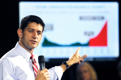 Republican vice presidential candidate, Rep. Paul Ryan, R-Wis., points at a power point presentation
