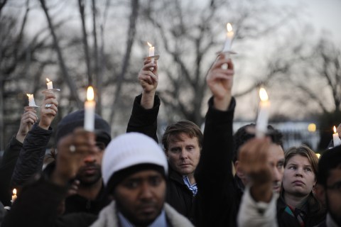 image: Supporters of gun control legislation hold candles and placards during a rally in front of the White House to pay respect for the victims of a deadly shooting spree at Sandy Hook Elementary School in Newtown, Conn., on Friday, Dec. 14, 2012.
