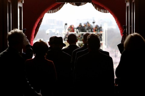 President Barack Obama pauses with his escorts before walking through the Lower West Terrace Door of the U.S. Capitol to begin swearing-in ceremonies in Washington, DC., on Jan. 21, 2013.