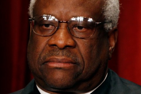 U.S. Supreme Court Associate Justice Clarence Thomas poses for a portrait in the East Conference Room at the Supreme Court Building in Washington