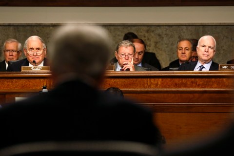 Senators watch as former U.S. Senator Hagel testifies during Senate Armed Services Committee hearing on his nomination to be Defense Secretary, on Capitol Hill in Washington
