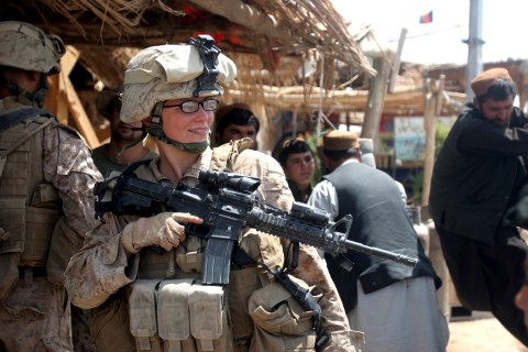 U.S. Marine Corps handout photo of Lance Cpl. Stephanie Robertson speaking with civilians during an engagement mission in Marjah