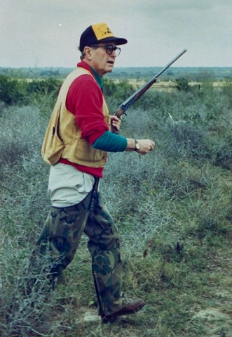 Former President George Bush dressed in hunting gear with shotgun in hand hunting quail on the Lazy F Ranch on Jan. 1,1989. 