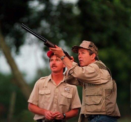 Republican gubernatorial candidate George W. Bush takes aim on a dove as he takes part in the opening of dove hunting season as Texas Waterfowl Outfitters guide Al Glos, left, looks on, Sept. 1, 1994, in Hockley, Texas.  