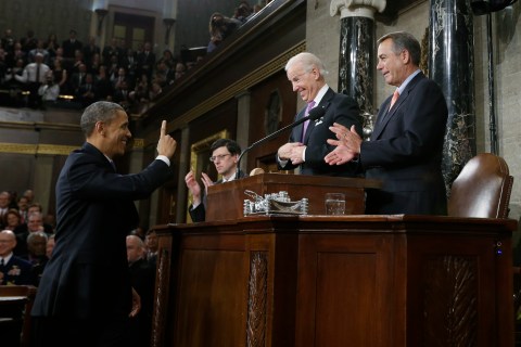 U.S. President Obama gestures toward Vice President Biden and House Speaker Boehner prior to delivering his State of the Union speech on Capitol Hill in Washington