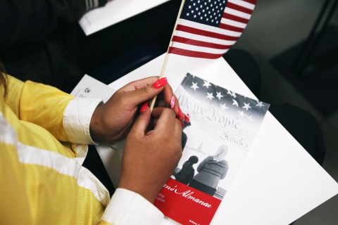 A woman waits to become an American citizen at a naturalization ceremony held at the U.S. Citizenship and Immigration Services (USCIS), office in New York City, on May 17, 2013.