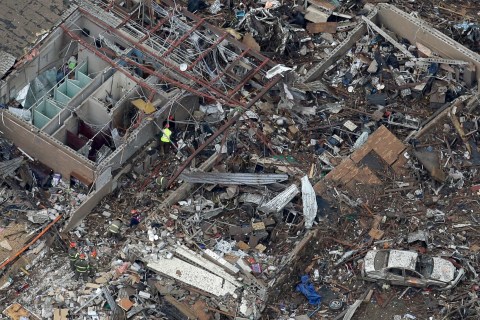 An aerial view shows Tower Plazas Elementary school as rescue workers make their way through the structure, in Moore, Okla., on May 21, 2013.