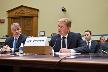 Henrik Fisker, founder of Fisker Automotive, right, testifies on Capitol Hill in Washington, April 24, 2013.
