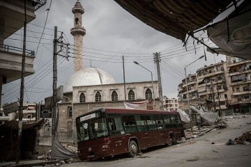 A bus used as barricade from sniper fire in Aleppo, Syria, on May 3, 2013