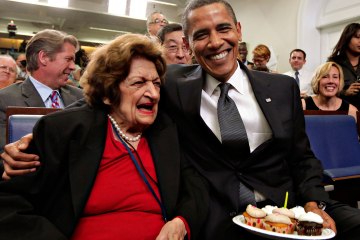 President Obama, marking his 48th birthday, takes a break from his official duties to bring birthday greetings to Helen Thomas, left, who shares the same birthday, in the White House Press Briefing Room in Washington, Aug. 4, 2009.