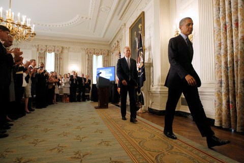 U.S. President Barack Obama leaves with Vice President Joe Biden after delivering remarks in White House in Washington