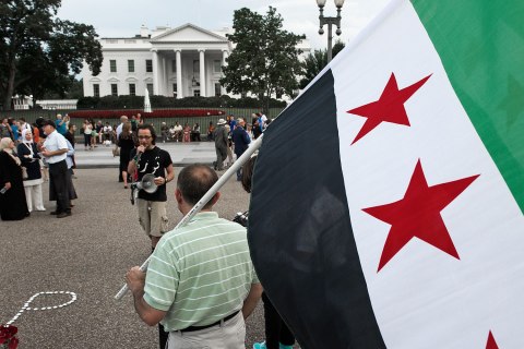 Protestors outside of the White House call for U.S. President Barack Obama to act on the reports of chemical-weapons use by Syrian President Bashar Assad against his own people, in Washington, D.C., on Aug. 21, 2013.