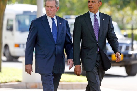 From left: former President George W. Bush and U.S. President Barack Obama attend a memorial for the victims of the 1998 U.S. Embassy bombing in Dar es Salaam, Tanzania, on  July 2, 2013.