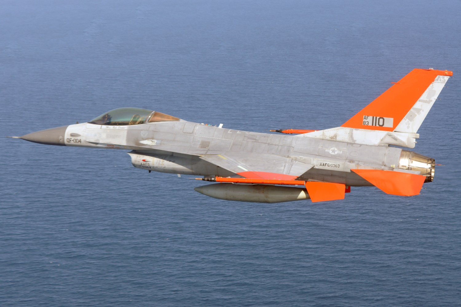 A pilot remotely controls a Q-F4 Phantom as it takes off from the