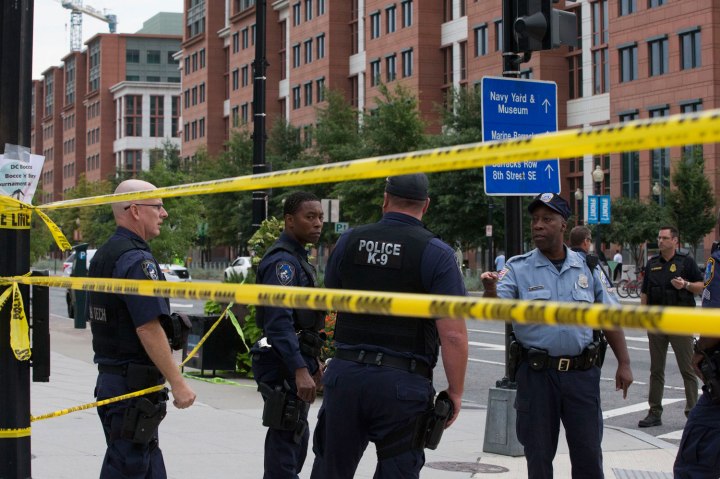 Police work the scene on M Street, SE in Washington, D.C., near the Washington Navy Yard, on Sept. 16, 2013. 