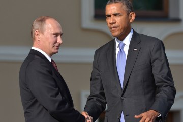 Russias President Vladimir Putin welcomes President Barack Obama at the start of the G20 summit on September 5, 2013 in Saint Petersburg.
