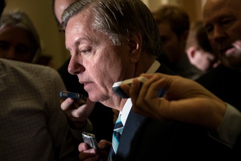 Senator Lindsey Graham speaks with reporters on Capitol Hill in Washington, October 16, 2013.