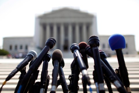 News microphones wait to capture reactions from U.S. Supreme Court rulings outside the court building in Washington