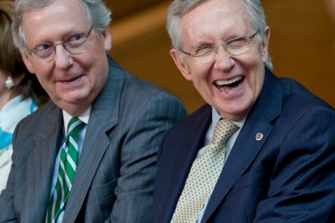 From left, Senate Minority Leader Mitch McConnell of Ky., and Senate Majority Leader Harry Reid of Nev., laugh during a ceremony to dedicate the statue of Frederick Douglass in the Emancipation Hall of the United States Visitor Center on Capitol Hill in Washington, Wednesday, June 19, 2013. 