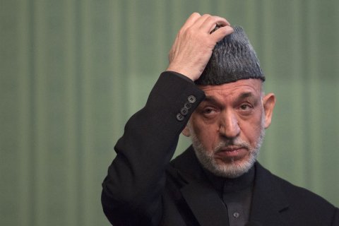 Afghan President Hamid Karzai gestures during a press conference at the Presidential Palace in Kabul on January 25, 2014.