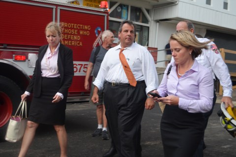 New Jersey Governor Chris Christie (center) and Deputy Chief of Staff Bridget Anne Kelly (right) walk at the scene of a boardwalk fire Sept. 12, 2013 in Seaside Heights, N.J.